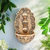 Sacred Hearts Holy Water Font shown hanging on a wall