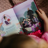 Another photo of a girl reading the Princesses of Heaven