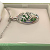 Side view to show the depth and thickness of the Cat's Eye Tree of Life Pendant