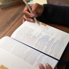 View of reader taking notes