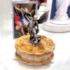 Small St. Michael Statue on top of wood case along with the mini St. Michael card