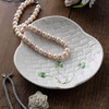Belleek Shamrock Canape Plate holding jewelry