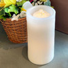 Photo of the White LED/Water Fountain Candle with the light on and the fountain on; batteries not included with purchase