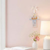 The 6IN Noah's Ark Wall Cross is shown hanging on a pink bedroom wall.
