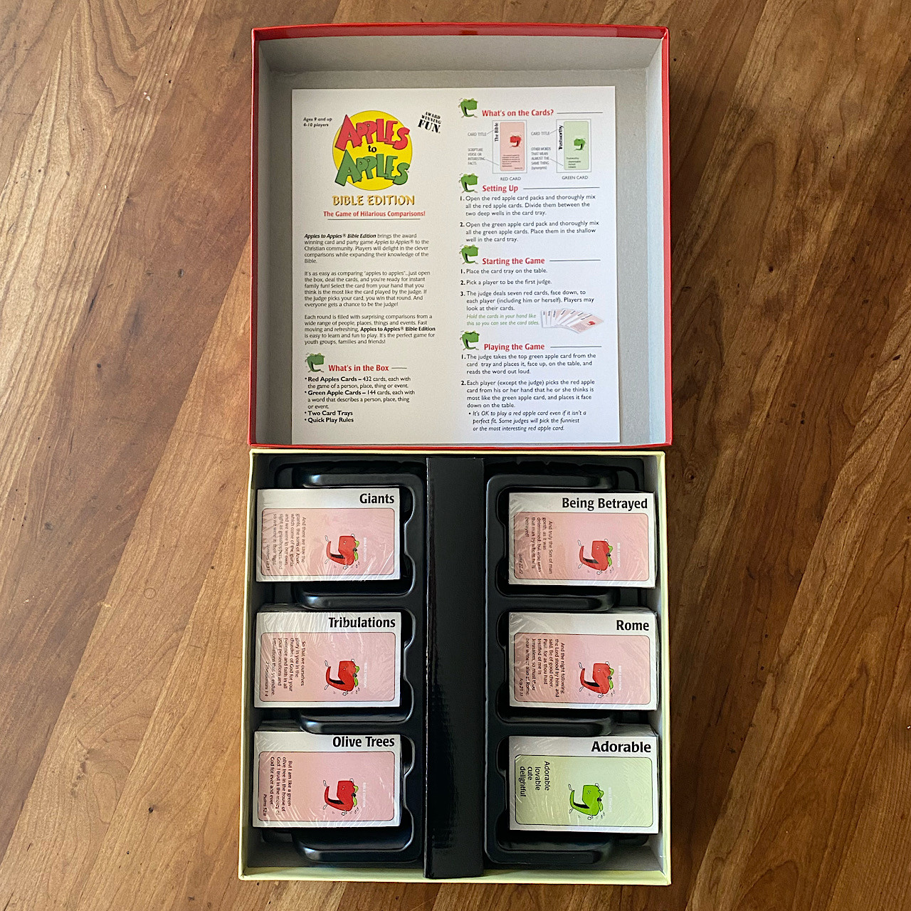 Inside the box of the Apples to Apples Bible Edition Game