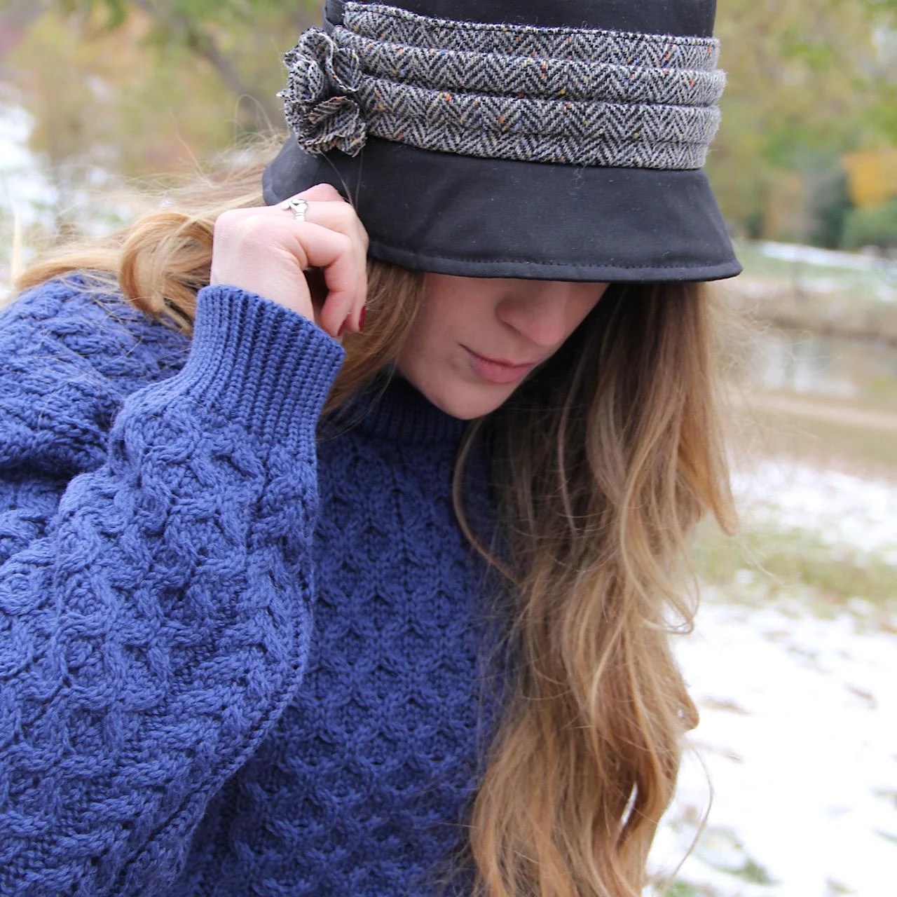 Model wearing Waxed Cotton Kate Irish Hat with Blue Irish sweater