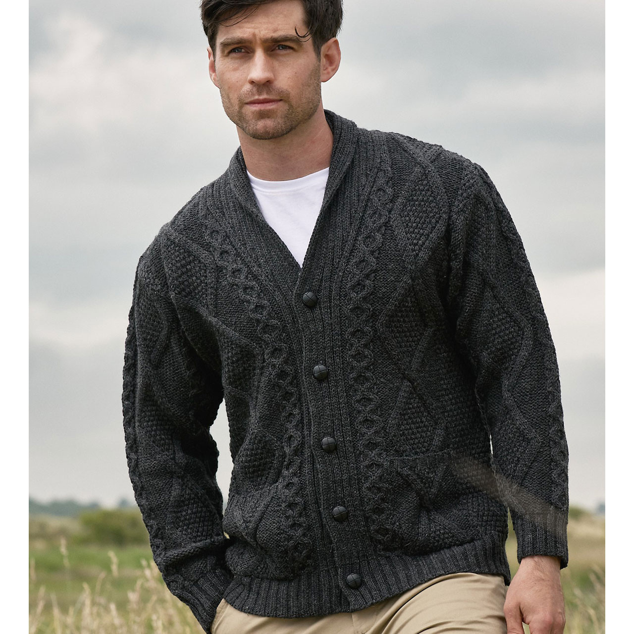 Front view of the charcoal Men's Irish Aran Cardigan Sweater showing pockets and shawl collar