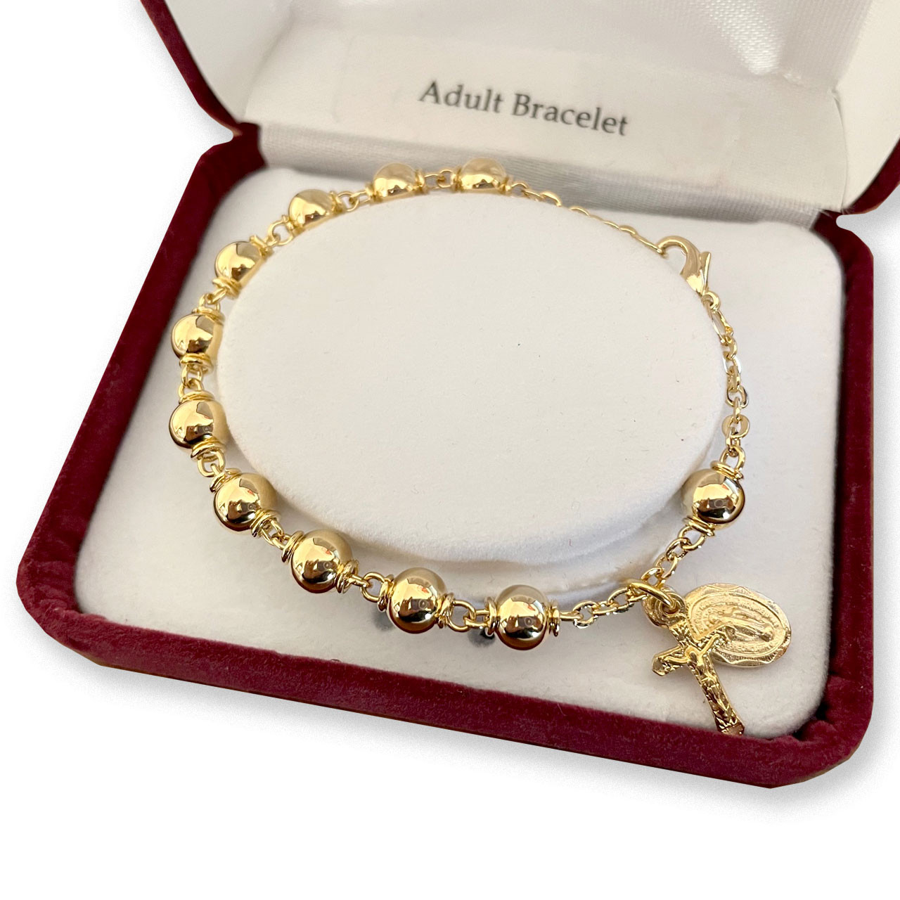 Gold Plated Rosary Bracelet shown in the deluxe gift box