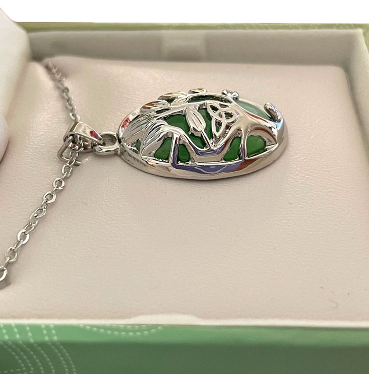 Side view to show the depth and thickness of the Cat's Eye Tree of Life Pendant