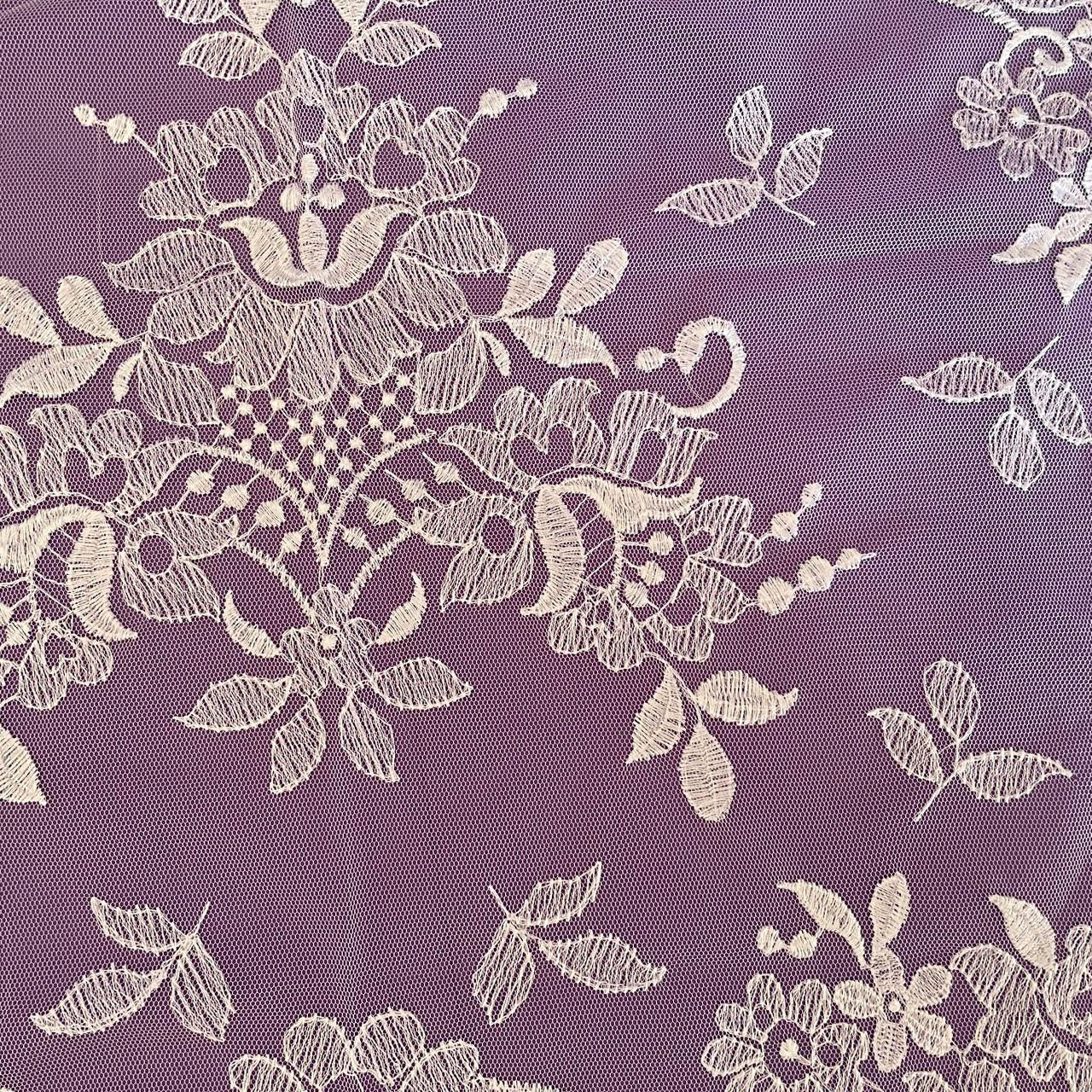 White Lace Chapel Veil shown on purple to highlight the center lace patterns