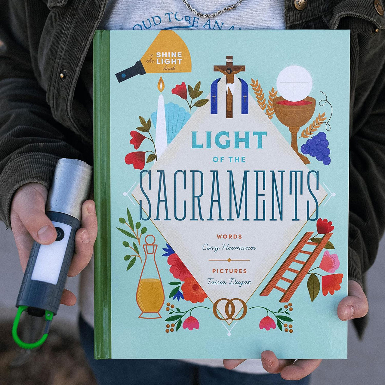 Front cover and child holding flashlight