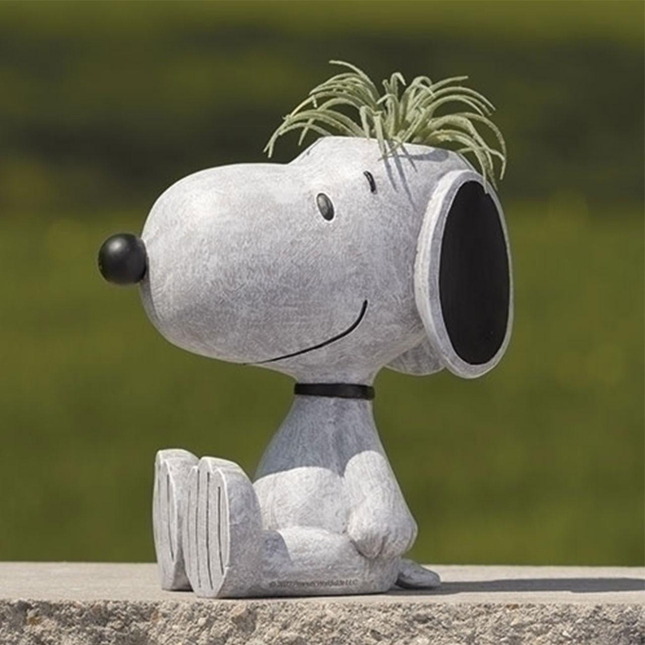 Snoopy planter shown with a plant, but a plant is NOT included with your purchase.