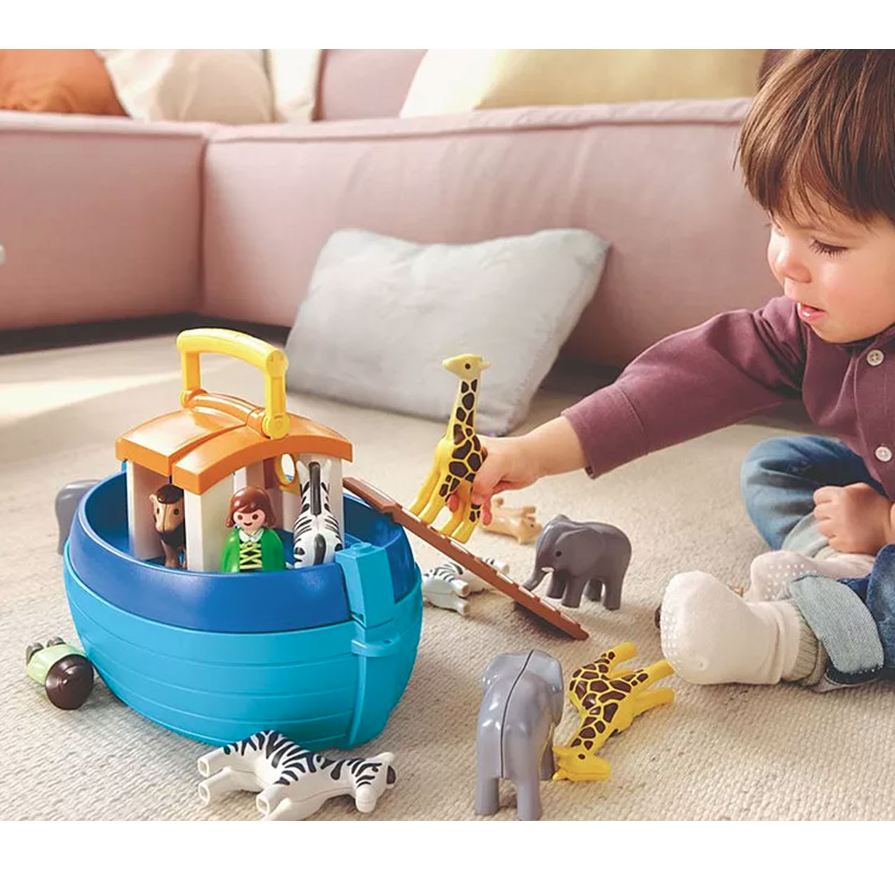 Child playing with the Playmobil My Take Along Noah's Ark