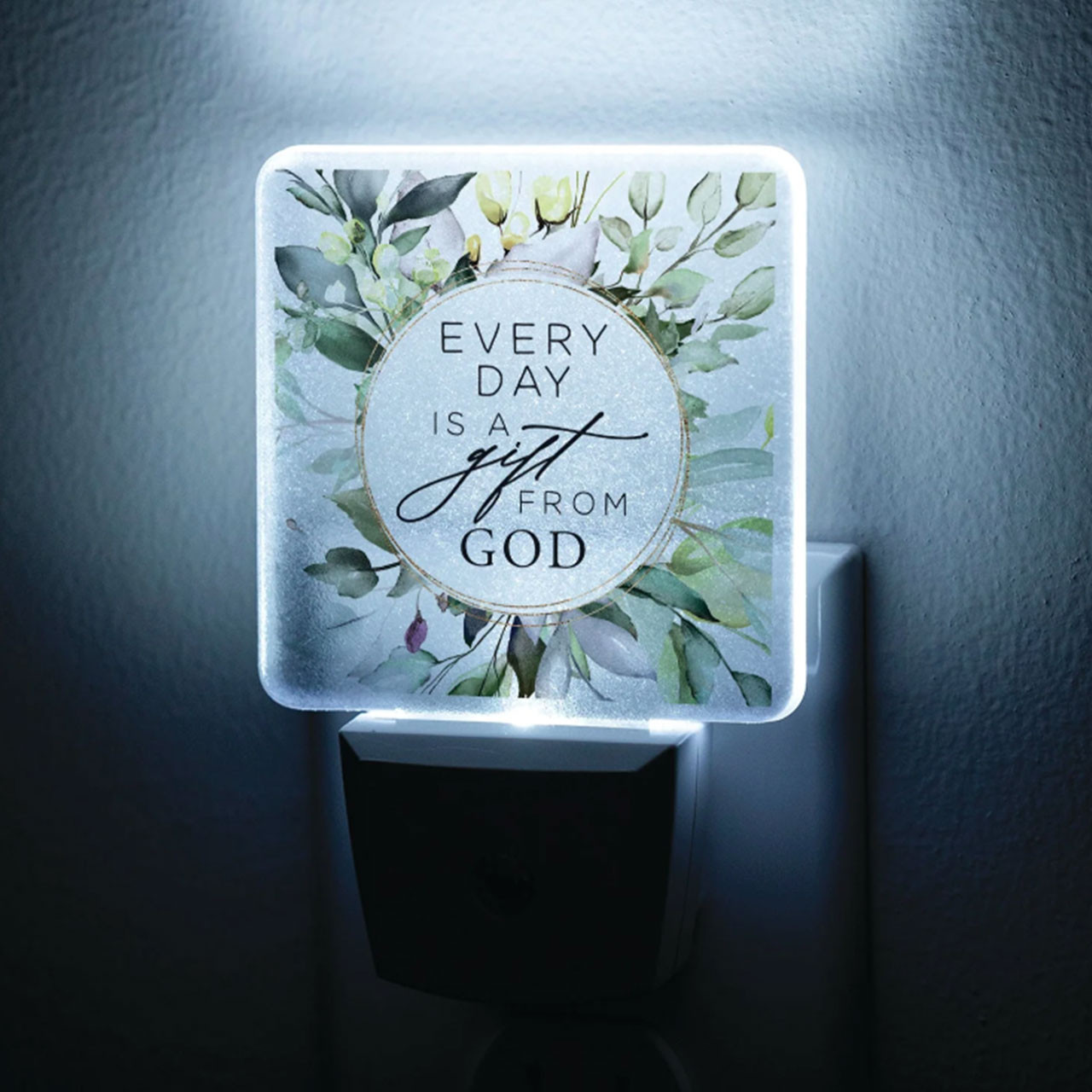 Every Day is a Gift Nightlight is shown in the dark with the LED light on illuminating the design