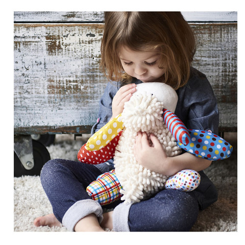 Child holding Lil Prayer Buddy Lamb