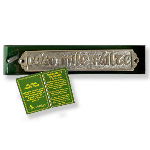 Ceade Mile Failte Door Plaque in the box with the information card that is included with purchase