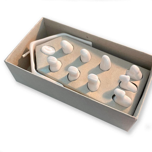 Inside the box of the tiny Porcelain Nativity Set