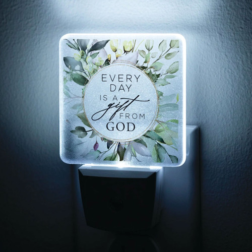 Every Day is a Gift Nightlight is shown in the dark with the LED light on illuminating the design