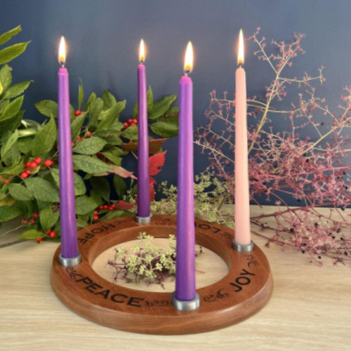 Large Cedar Joy Love Hope Peace Advent Wreath shown in a home with decorations with the Advent candles lit.