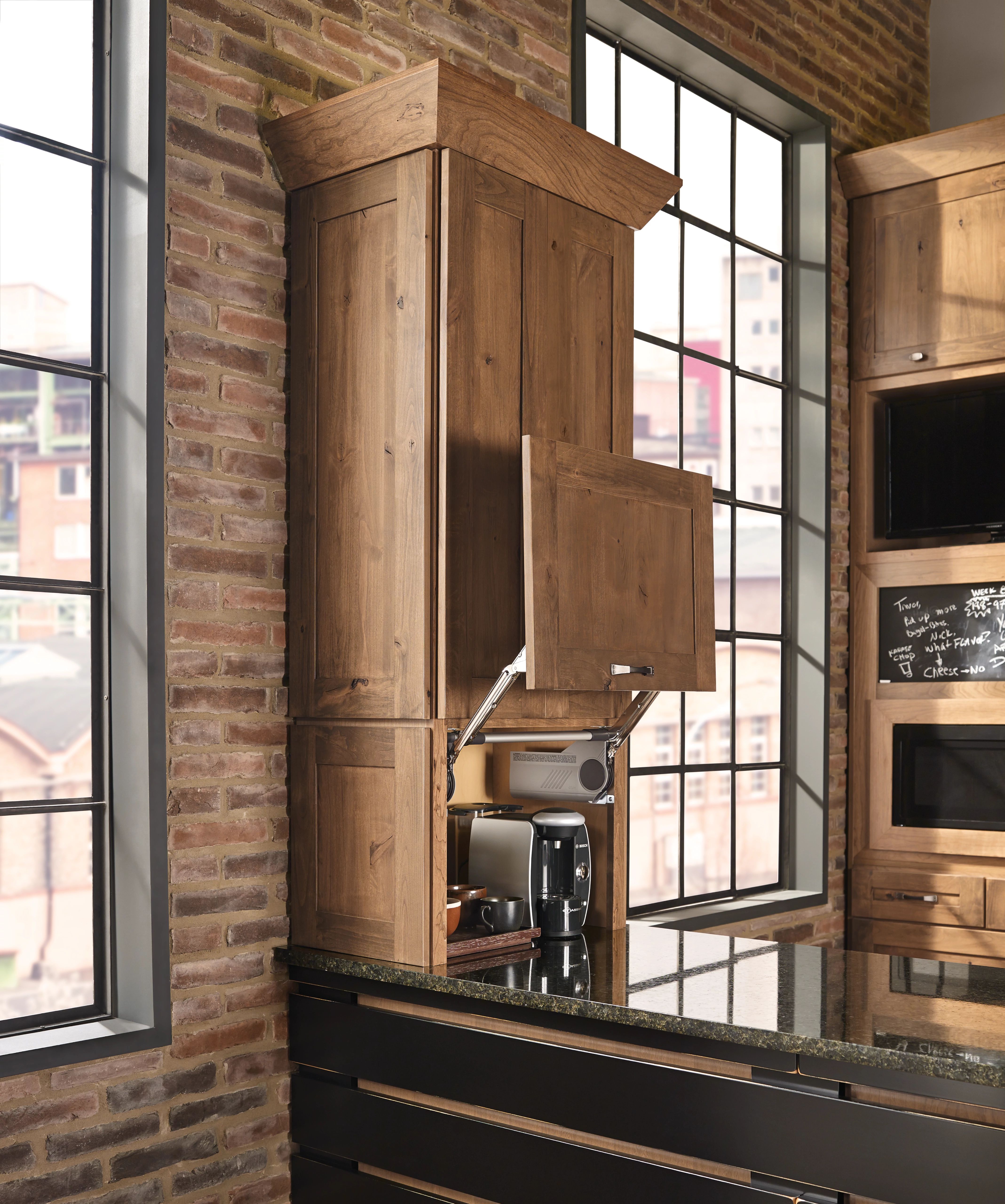 KraftMaid Rustic Alder cabinet with Husk stain in industrial-style kitchen with appliance garage