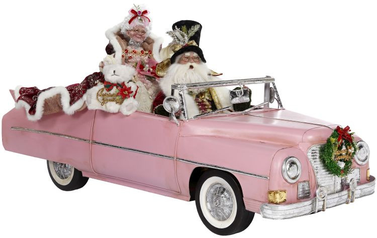 Santa & Mrs Claus and their Pink Convertible