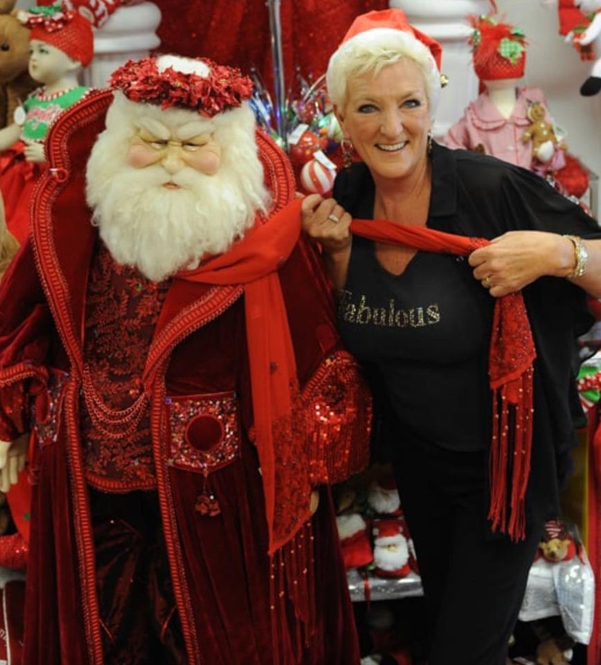 Diane Silverstein of Absolutely Fabulous with a Life-Sized Santa they sell.