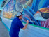 D.Friel working on The Cove mural.