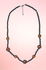 Leopard beads on balck tiki vintage necklace.