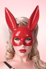 Blond model in retro styling wearing the glossy red bunny masquerade mask.