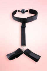 bondage ball gag and wrist cuff restraint set.