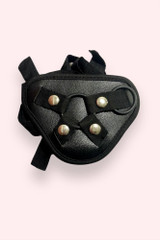 Adjustable Harness Strap for Strap-on dildos in black laid flat close up