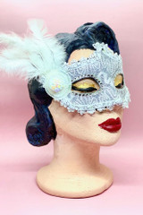 Silver Lace Masquerade Mask with White Side feather Accent on a vintage style mannequin head quarter side view