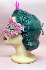 Pink Lace and Masquerade Mask with Fuchsia Pink Side feather Accent on a vintage style mannequin head side view