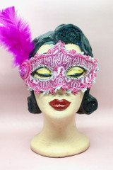 Pink Lace and Masquerade Mask with Fuchsia Pink Side feather Accent on a vintage style mannequin head front view