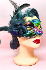 Rainbow Sequin Venetian masquerade mask with flower and Feather applique on a vintage mannequin head quarter side view