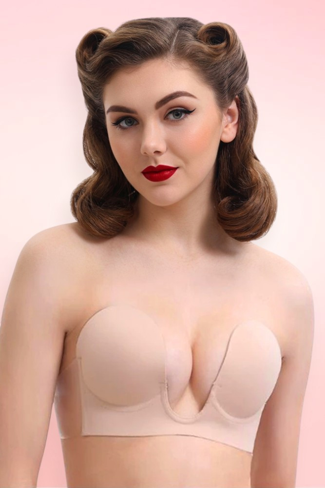 Beige sticky push-up adhesive bra worn on model, strapless and backless with front center clasp creating natural cleavage. 