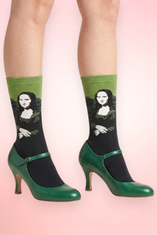 Mona Lisa art novelty crew socks worn with green Mary Jane heels.