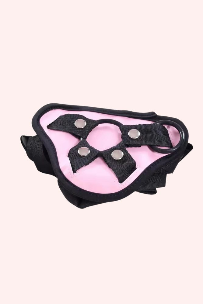pink strap on harness with straps up close