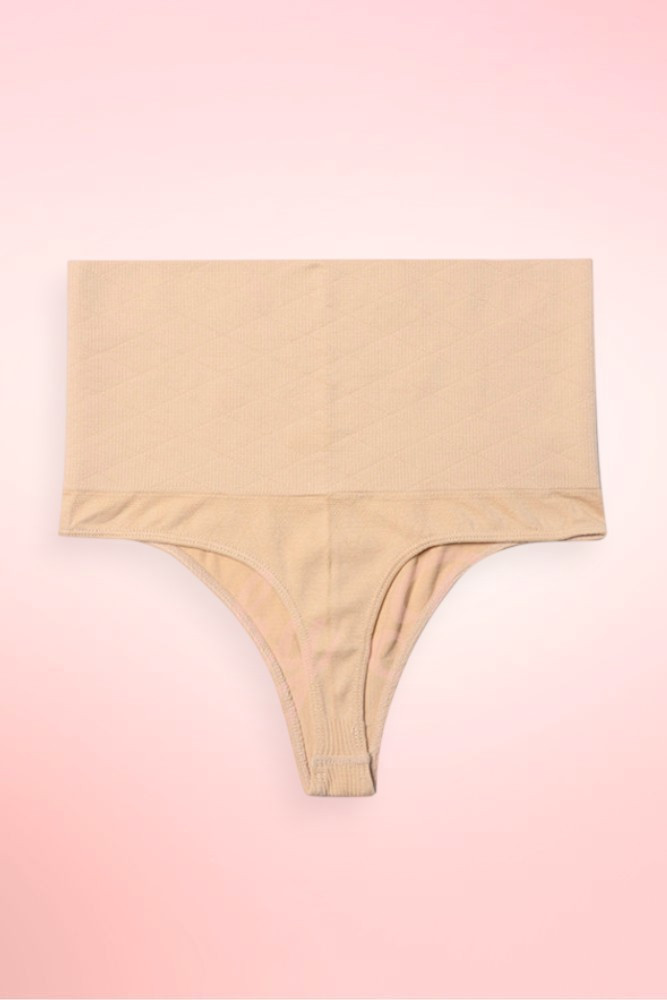 Nude high waist thong shapewear flat lay showing tummy trimmer waistband and seamless thong.
