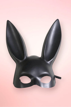 Isolated front view of a matte black bunny masquerade mask.