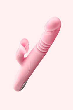 quarter view of the Pink Nicholas Thrusting  Rechargeable Vibrator showing the clitoral stimulator and the tip of the dildo