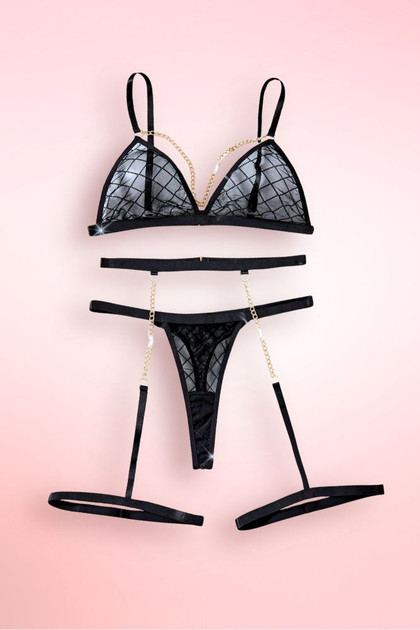 Black lace bra and garter belt lingerie set.