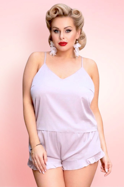 Plus Size woman wearing nude satin camisole shorts set.