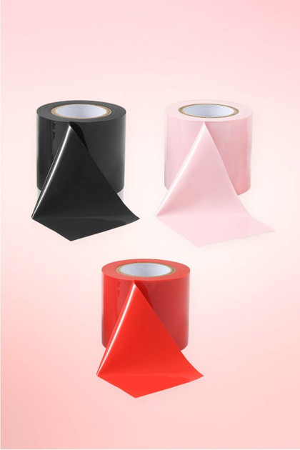 black light pink and red bondage tape rolls.