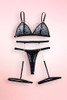 Black lace bra and garter belt lingerie set.