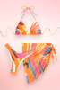 Orange 3 piece Swimsuit with Sarong skirt.