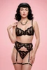 Black embroidered lace bra garter belt and thong lingerie set.