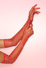 Red sparkle rhinestone fishnet gloves, long opera length with scattered crystal rhinestones, worn on both arms against pink background.