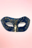 Handmade navy and gold Venetian masquerade mask flat lay on pink background.