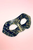Handmade navy and gold Venetian masquerade mask angled right on pink background.